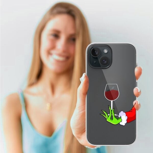 Kobieta z etui na telefon z winem.